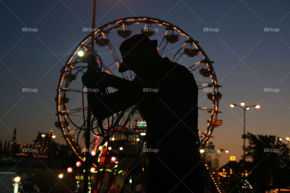 silhouette of musician getting ready for a set
