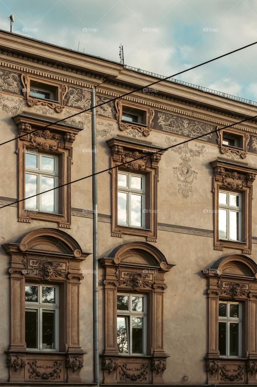 the facade of the tenement house beautifully decorated with paintings