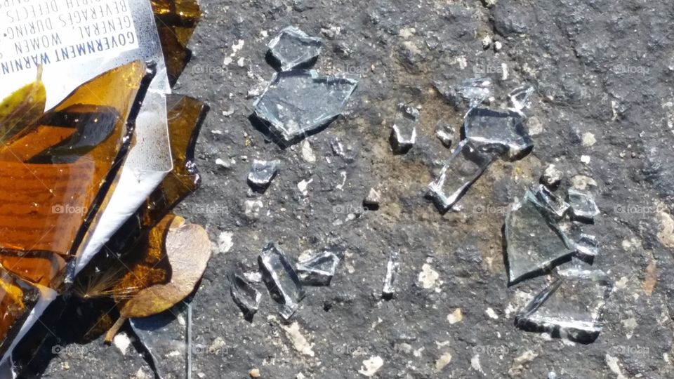 broken glass on asphalt