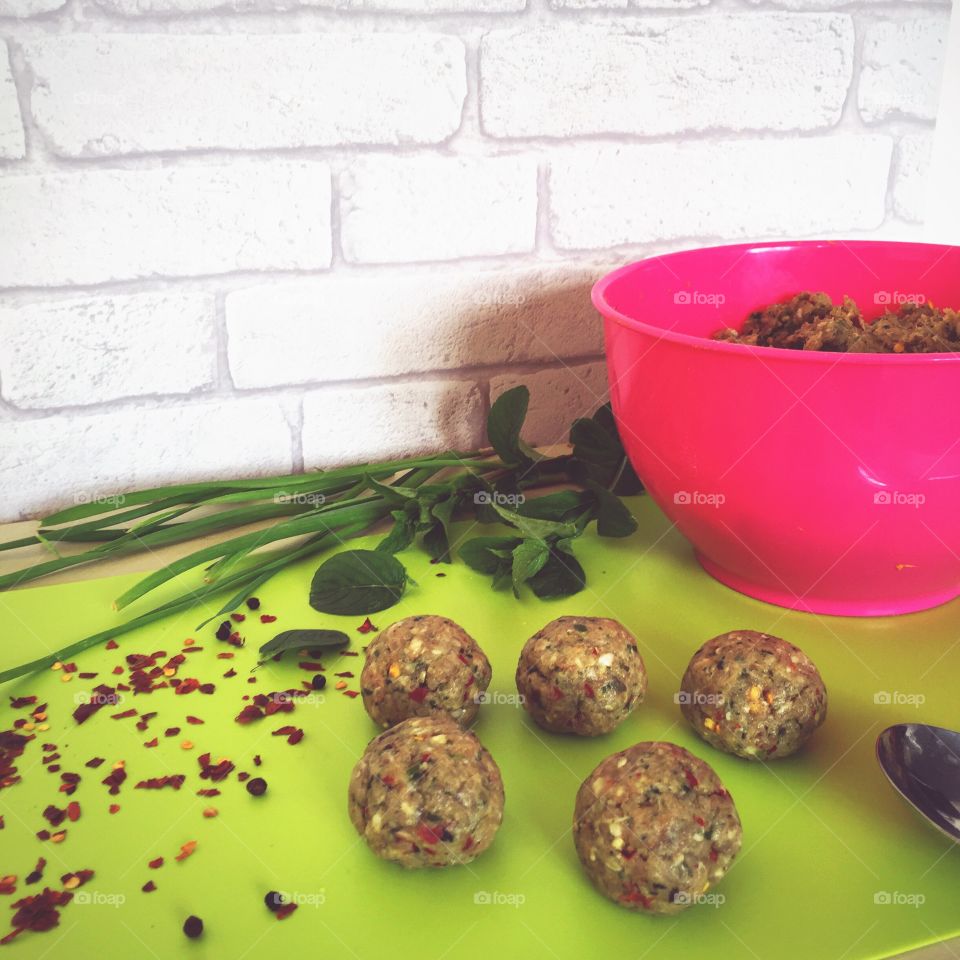 Homemade meatballs with spices and home grown wild garlic and mint