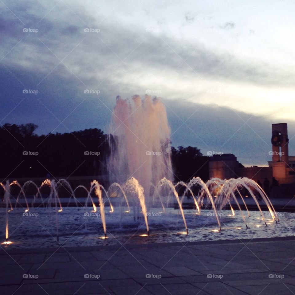 A fountain and a sunset