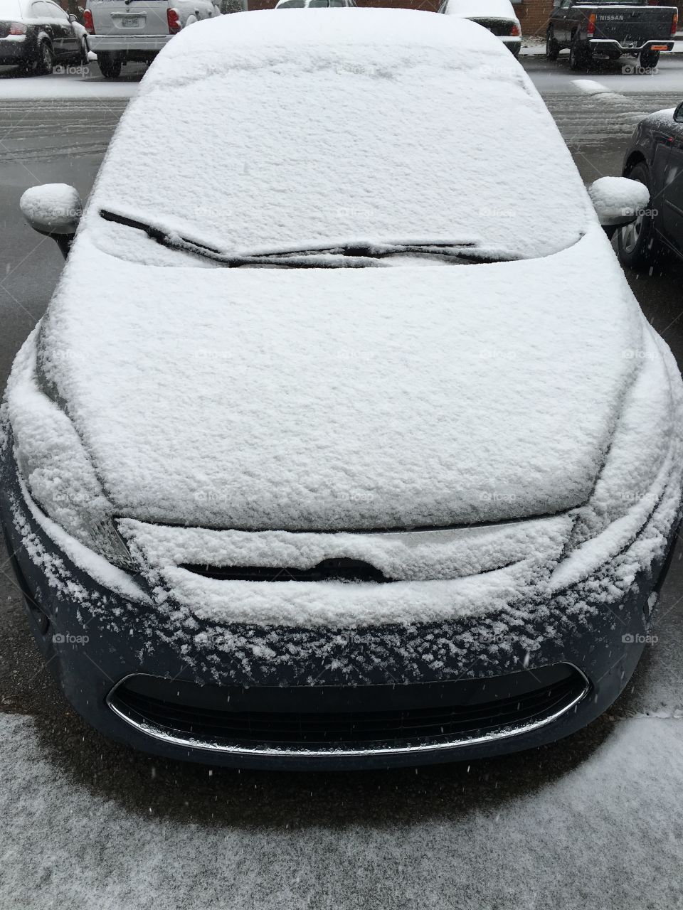 Snow covered car.