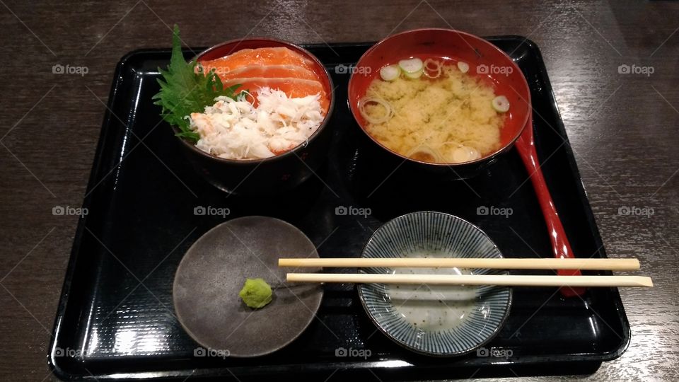 Most delicious salmon sashimi ever tasted. miso soup, wasabi, rise and chopsticks.
