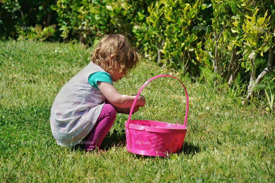 Toddler Girl With Pink Easter Basket