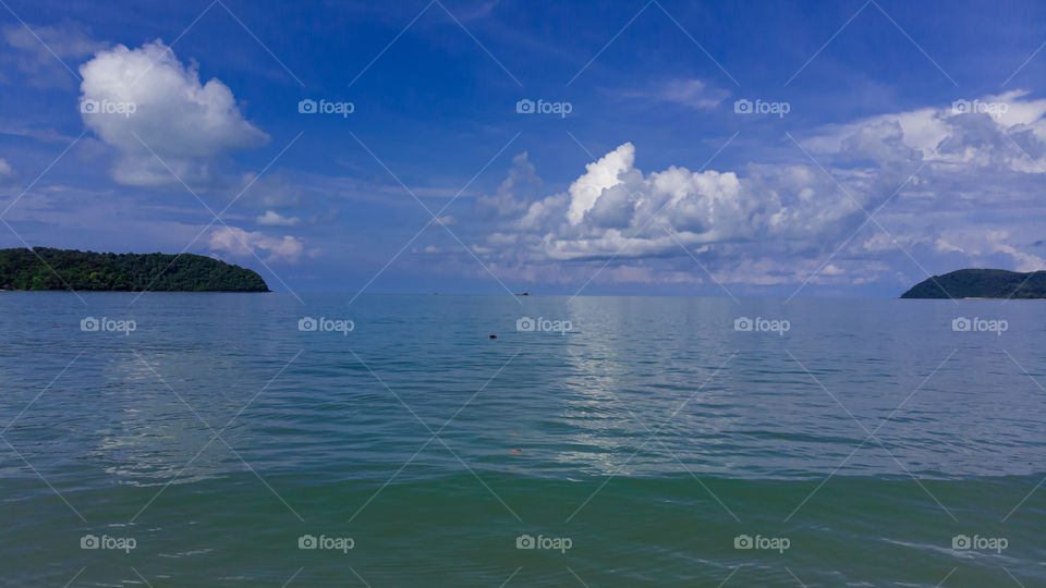 beautiful sea with cloudy blue sky
