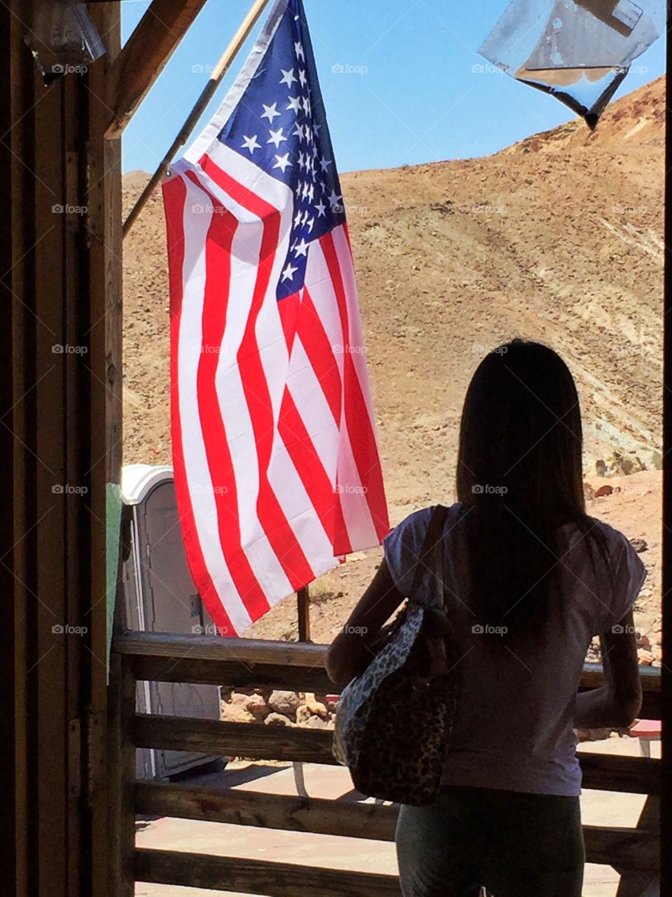 Woman On the door. American desert place is all around