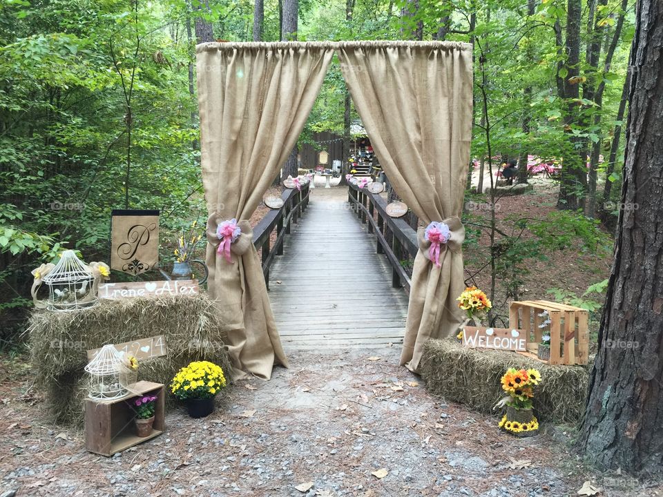 Entry to the outdoor reception area of my sister-in-law's wedding in the country woods, crossing a bridge to get to the historic schoolhouse. 
