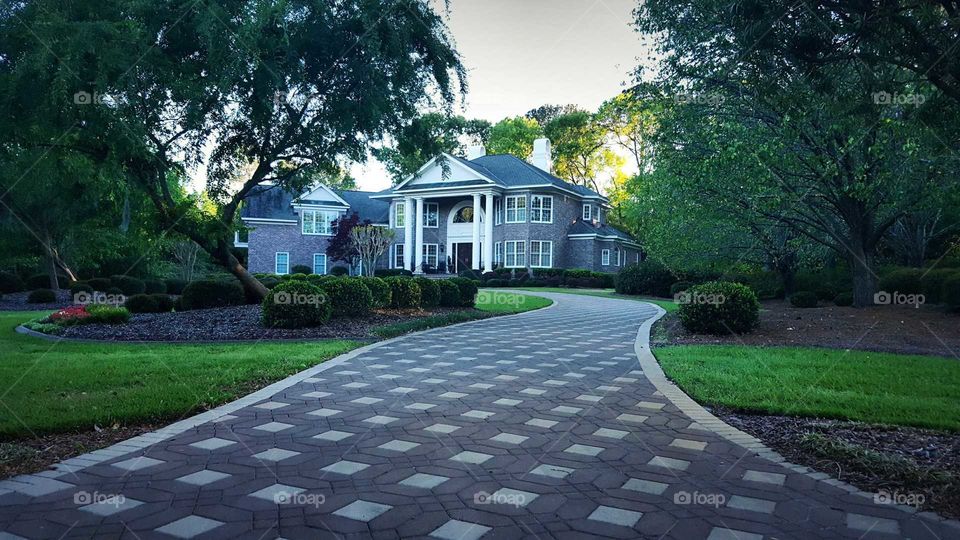 very large house with a custom driveway