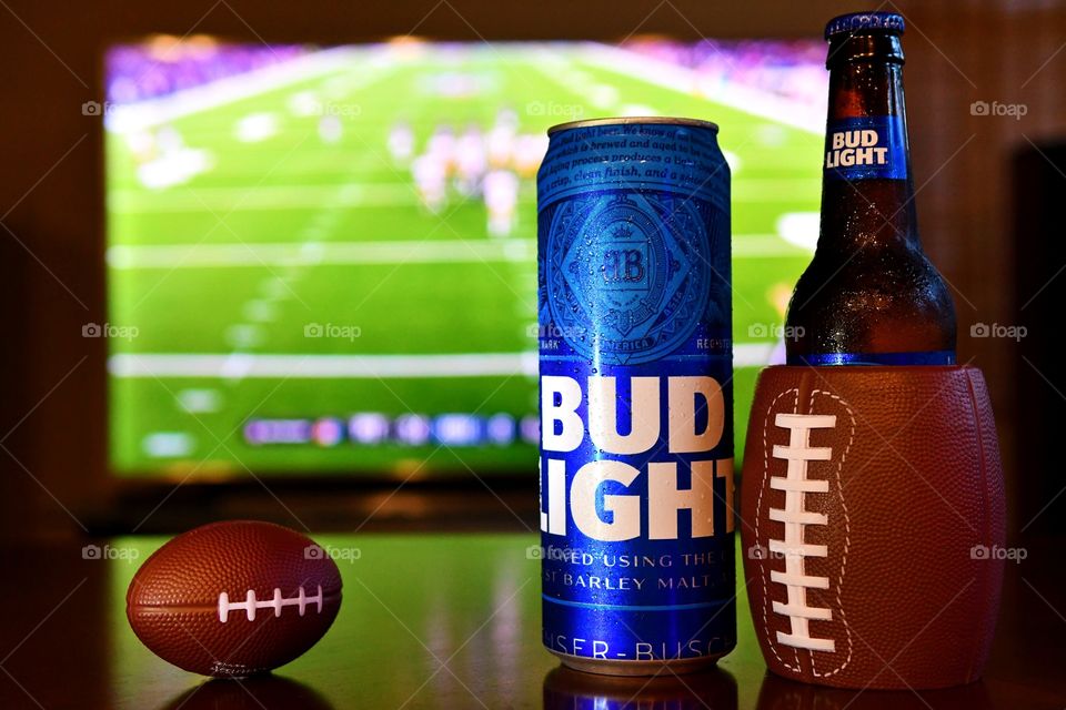 Watching football with Bud Light beer