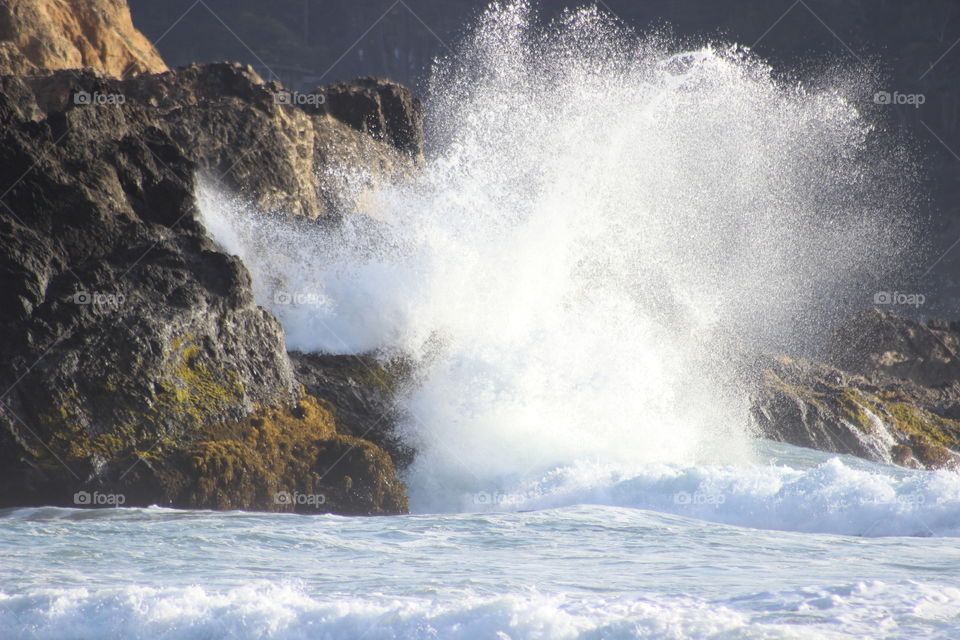 Wave crashing on rocks