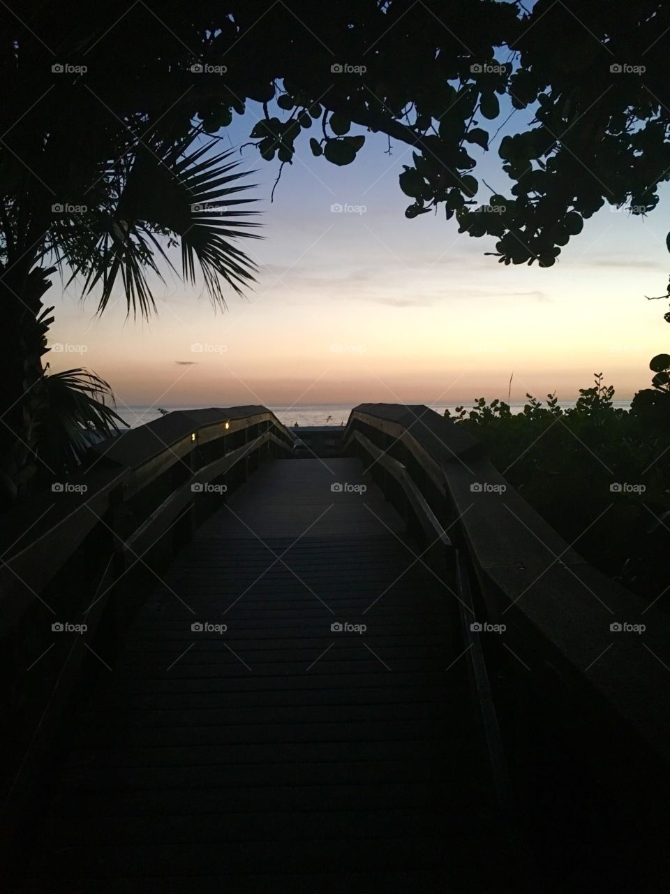 Where the boardwalk leads to the ocean 