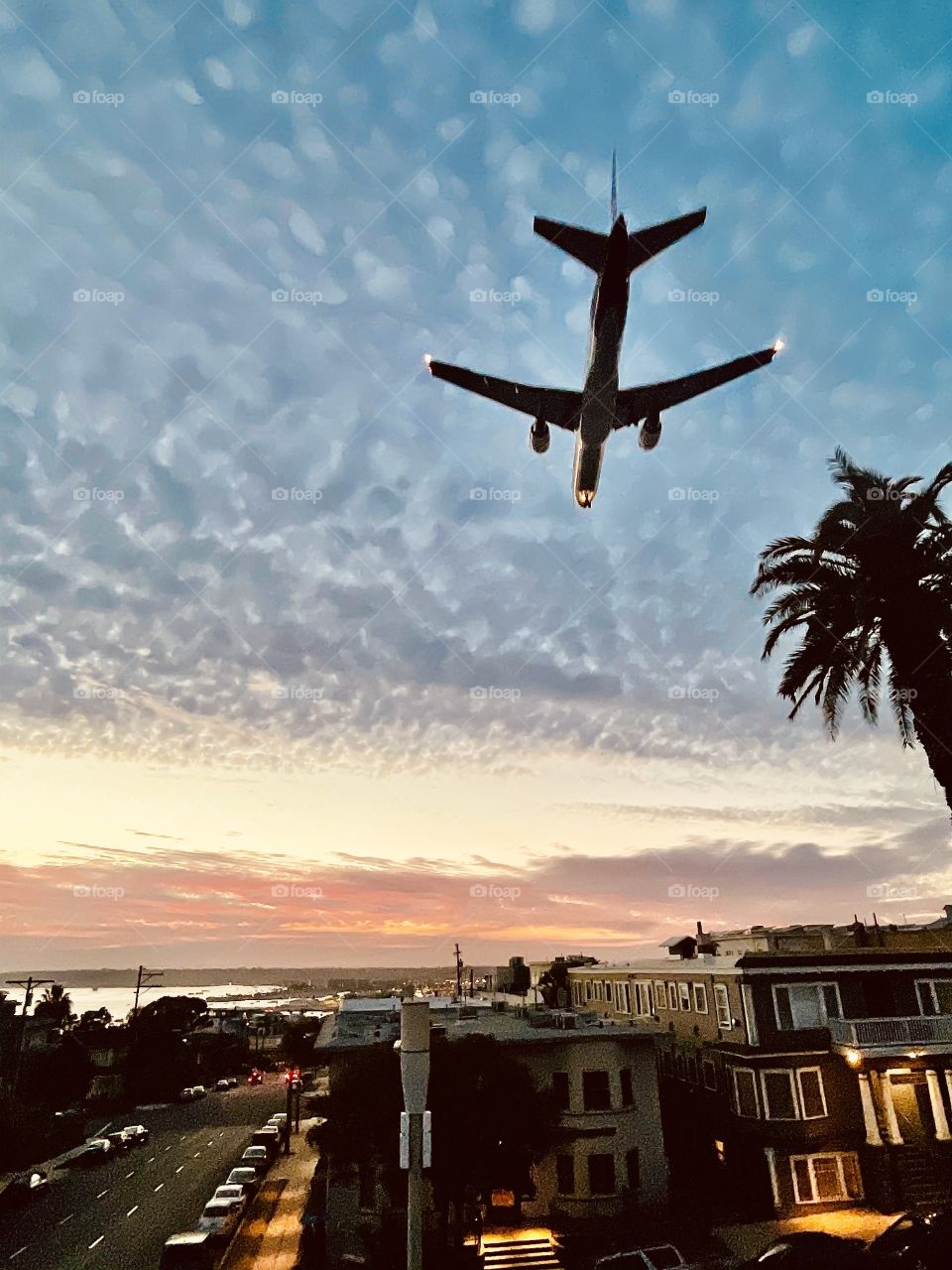 View from below airplane landing at San Diego airport 