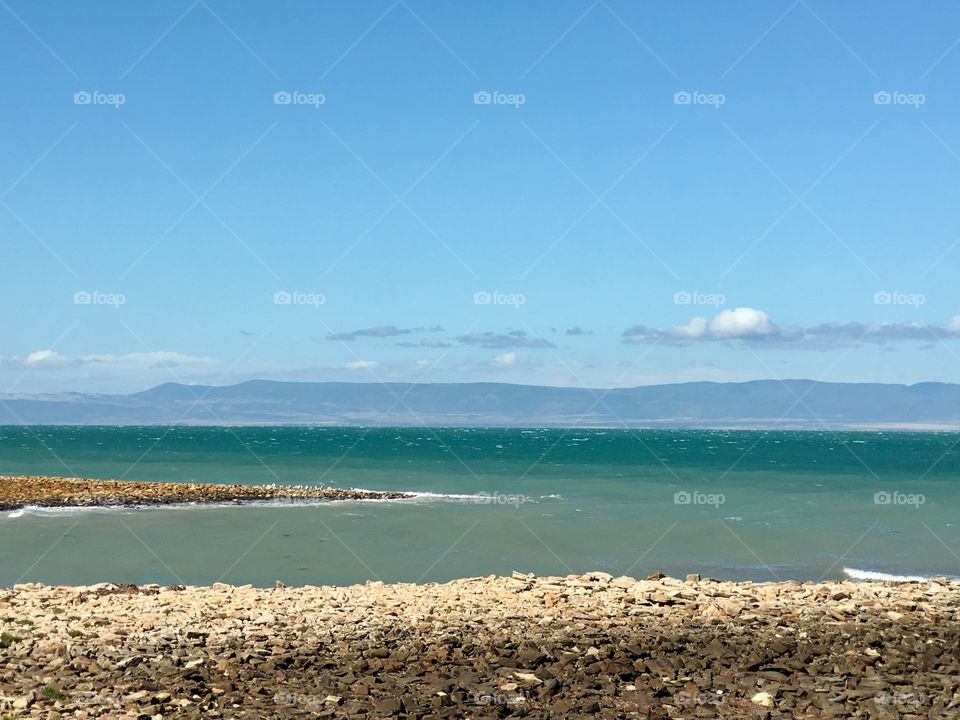 Quiet little bay in Spence Gulf in Eyre peninsula in south Australia, with Flinders mountain ranges in distance 