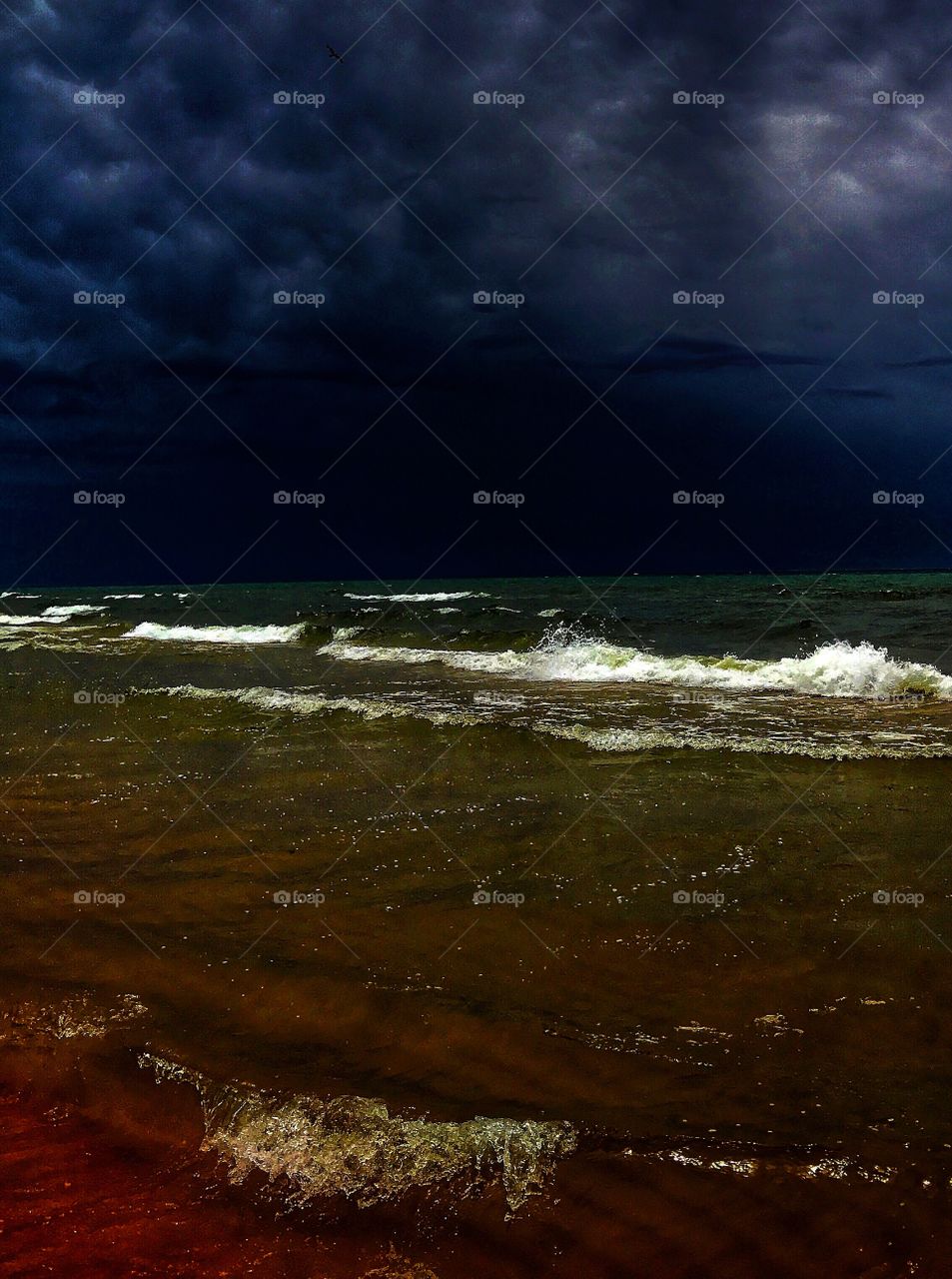 Ominous-looking thunderstorm passing over Lake Michigan—taken in Ludington, Michigan 