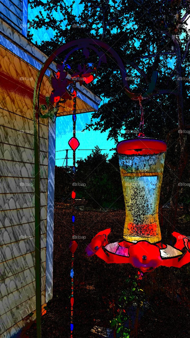 Bright red bird feeder