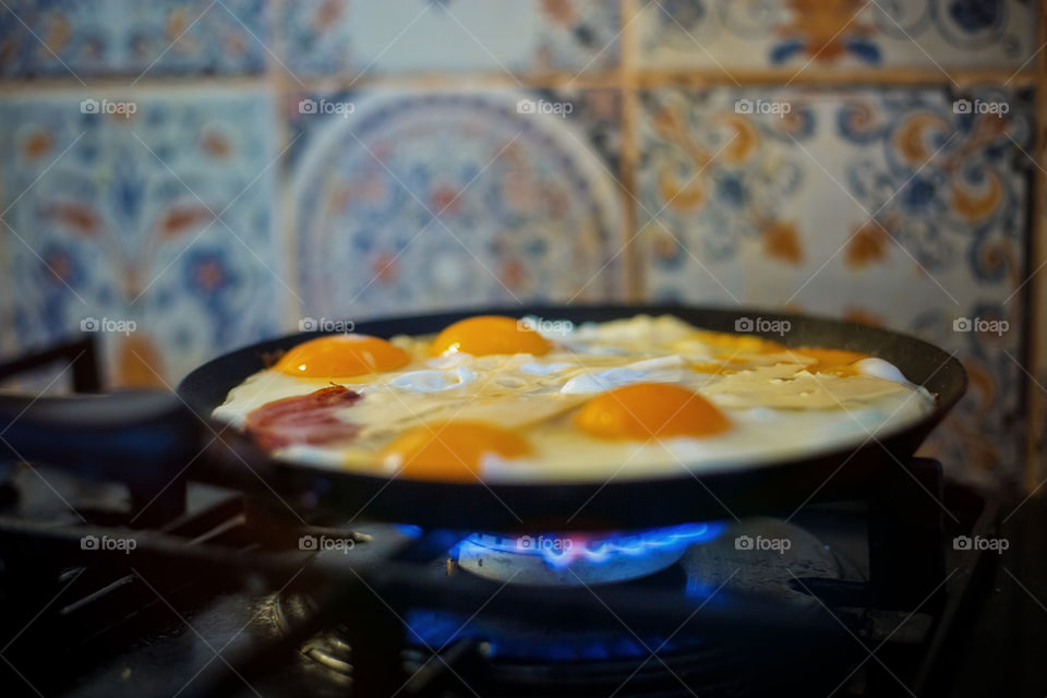 Fried eggs with bacon and cheese 