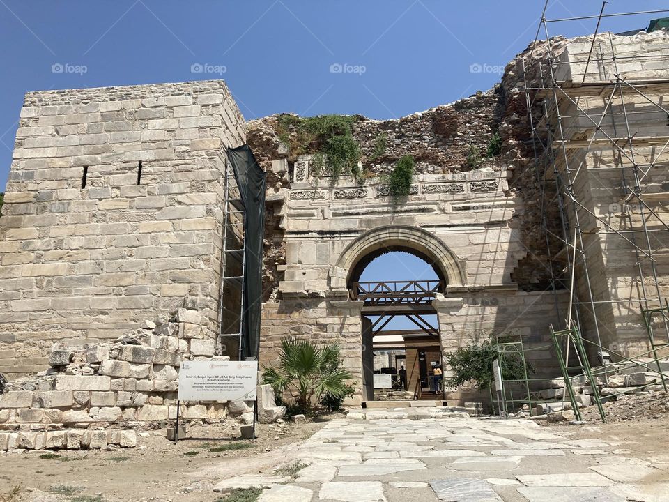 Ruins. Sunny holidays I’m Turkey. Walk in the cute city and charming streets by the beach in Kusadasi. perfect blue sky and ocean view. Beach and the shore. To travel is to live. Gorgeous tall palm trees.