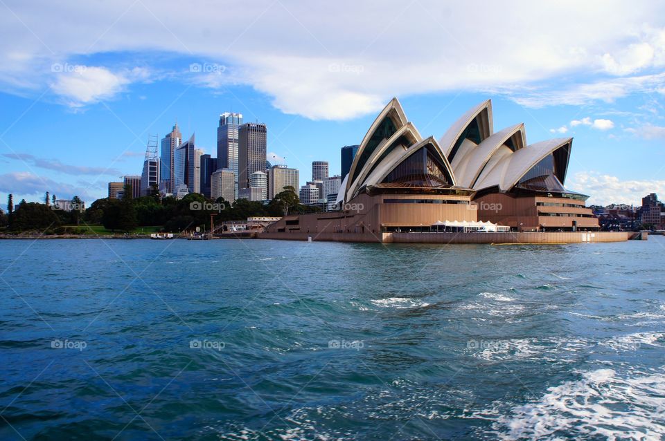 A view of the Opera House and the Sydney Skyline from a boat in the harbor 