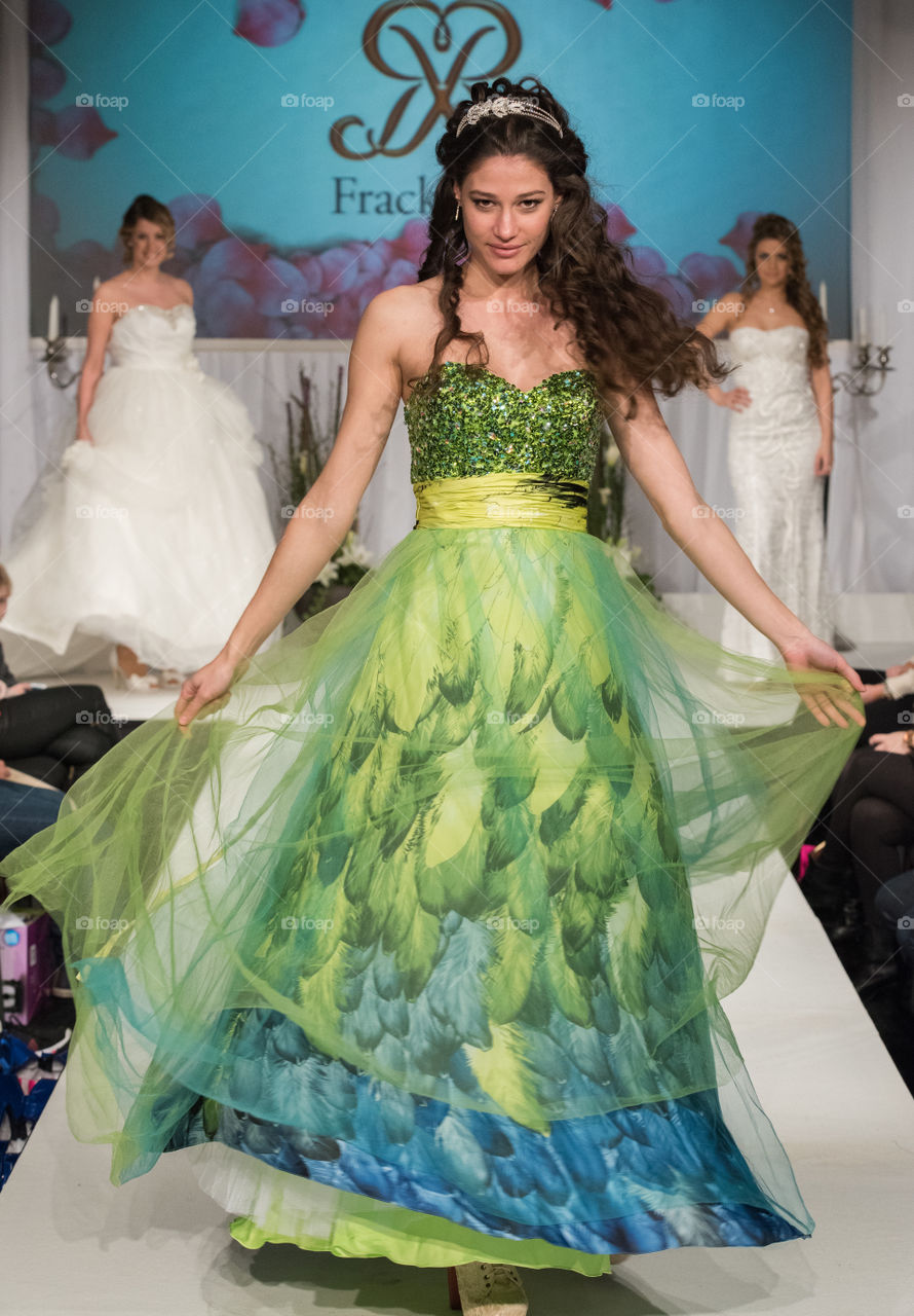 Fashion show at a wedding fair. Here are the latest dresses and clothes for both bride and groom.