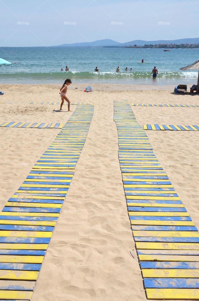 A child plays on the beach