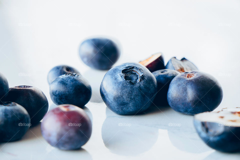Fresh organic blueberries on a marble background