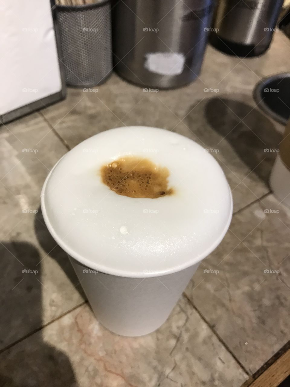 Cappuccino at local coffee shop, coffee to go, milk, foam  