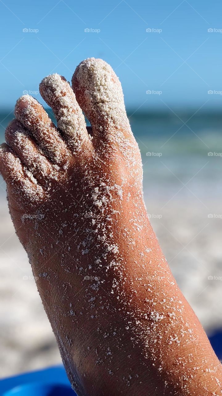 after walking a long way along the beach, nothing like resting with your feet full of sand.