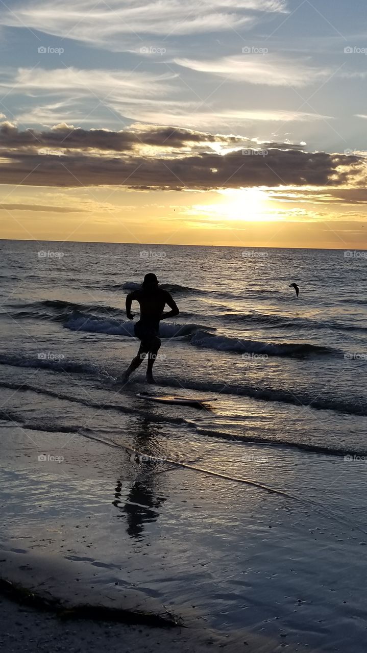 love how I got the skim boarder and the bird in the background