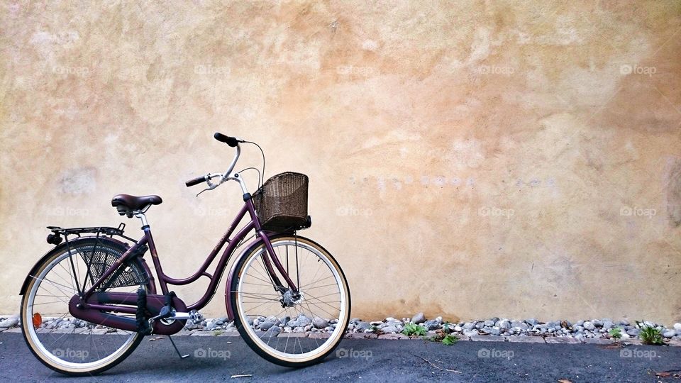 Retro city bike and yellow wall