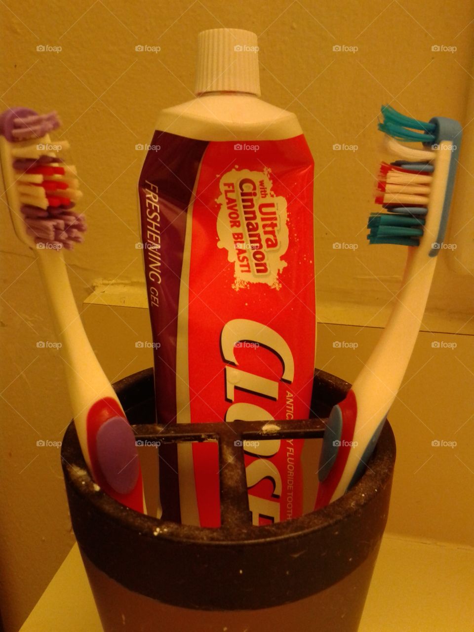 toothpaste & brushes. Toothpaste & toothbrushes cup