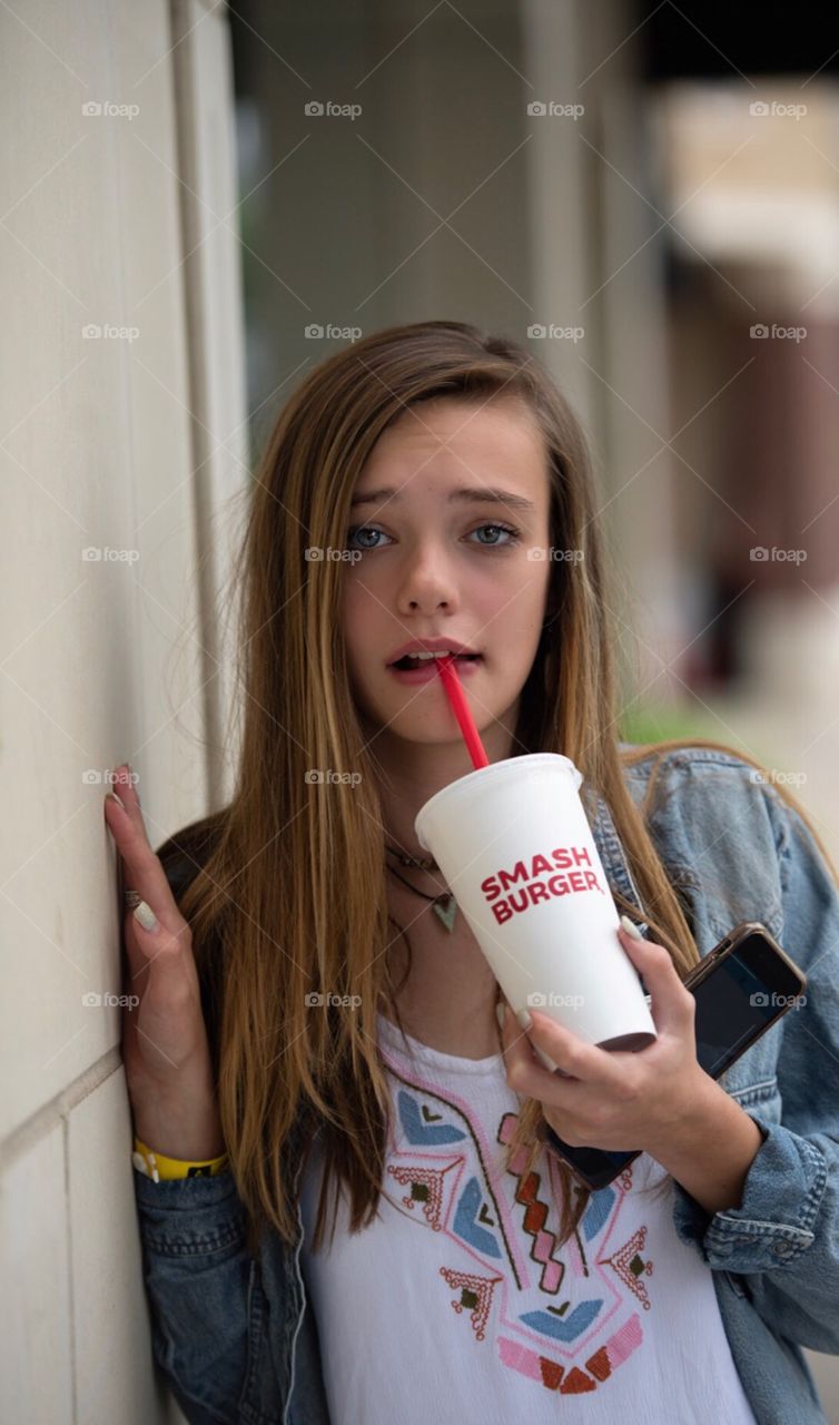 Girl holding cup 