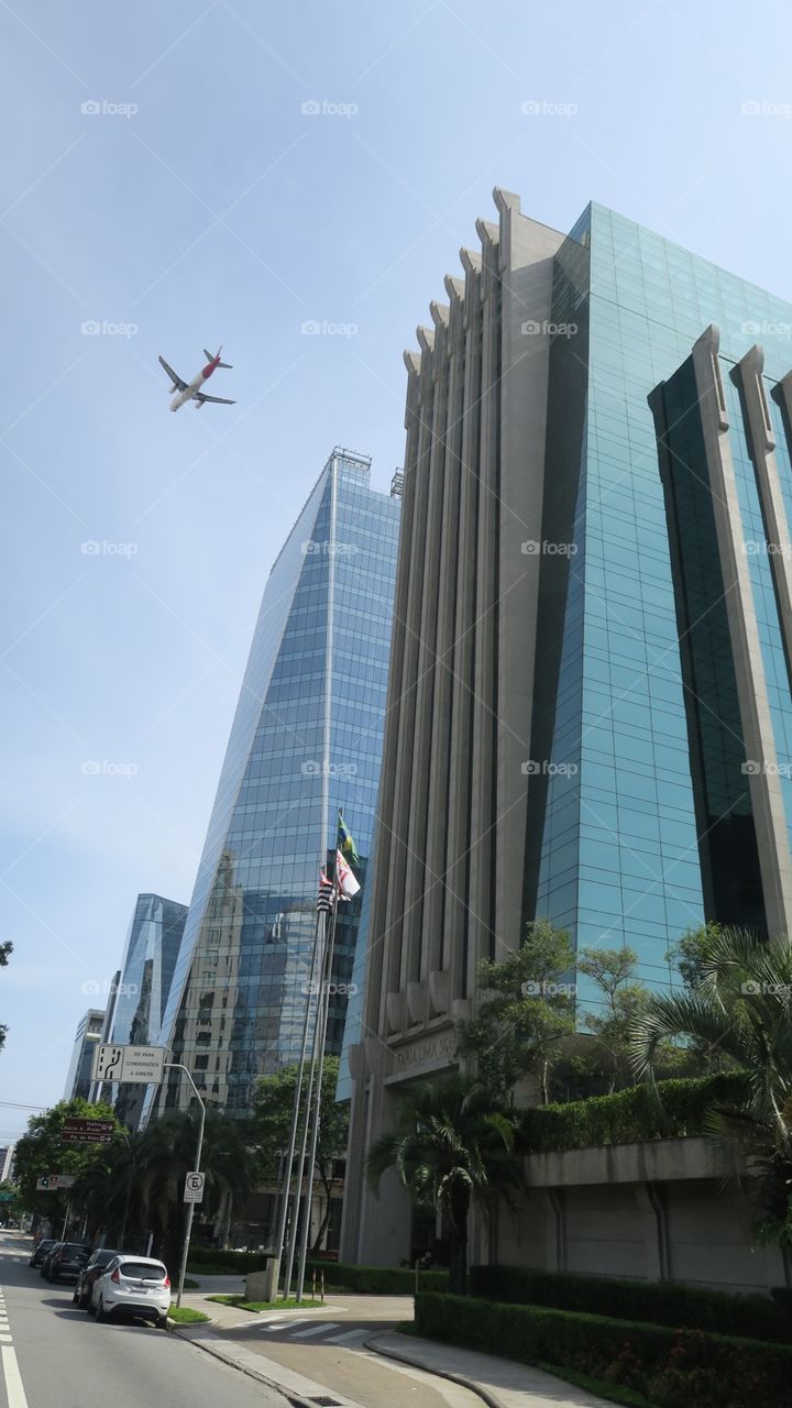 Airplane flying over the building