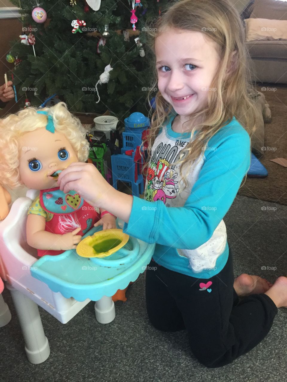 Small girl playing with toys