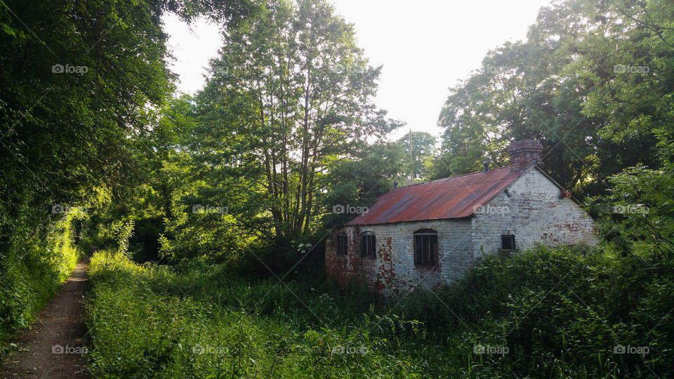 An abandoned building by a footpath in Wales, UK