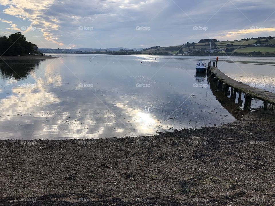 Coombs in Teignhead in late after noon of July 2019.  I love the way the water near the shore line, bursts into life, following the reflective activity.