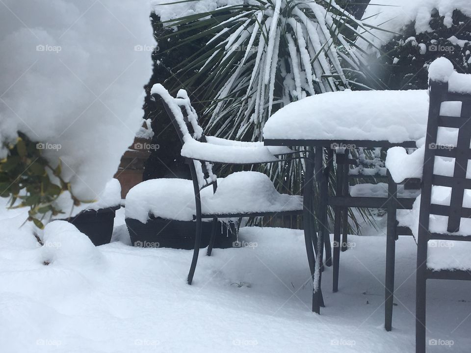 Snow fall onto the garden furniture 