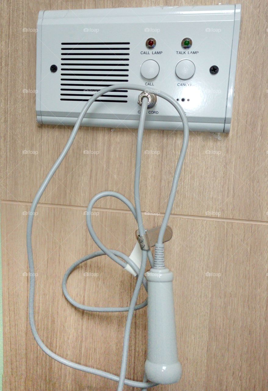 intercom attached to the patient room wall