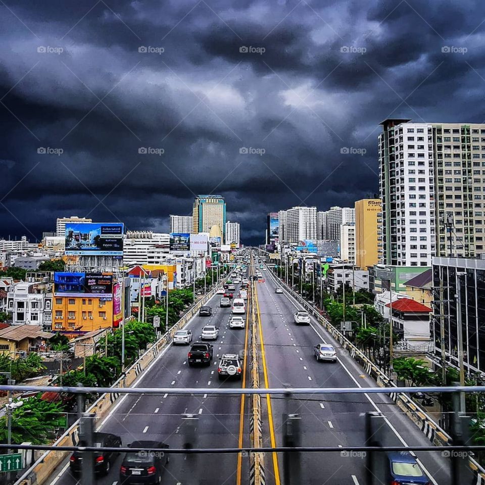 An intense thunderstorm descends upon Bangkok, Thailand. Photo taken from on board the BTS skytrain.