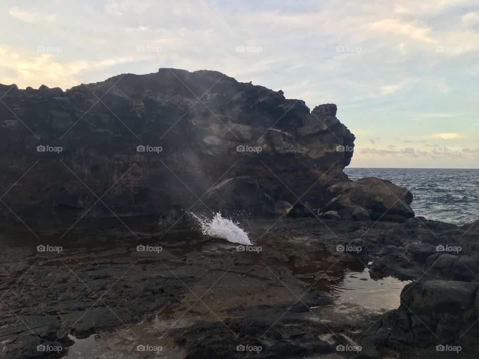 View of rock formation in sea