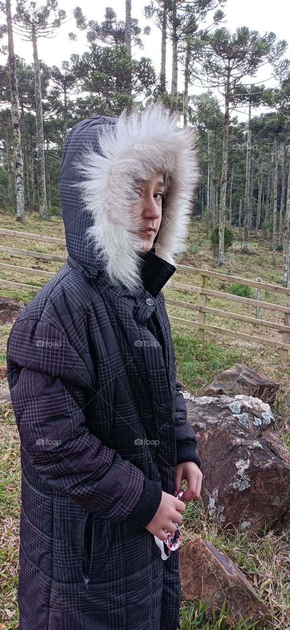 girl in hood coat in winter