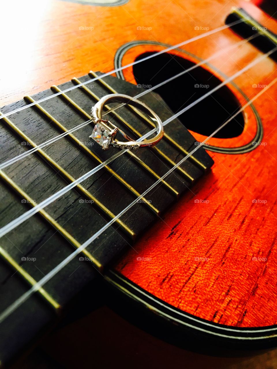 Engagement ring on a ukulele