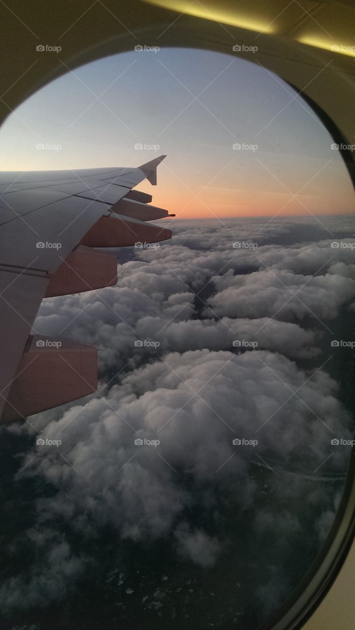 Aircraft wing above the clouds