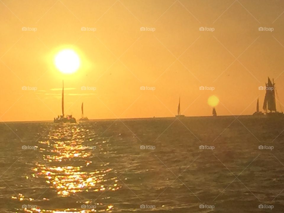 Sunset and other sailboats, from a sailboat in Key West, Florida, USA