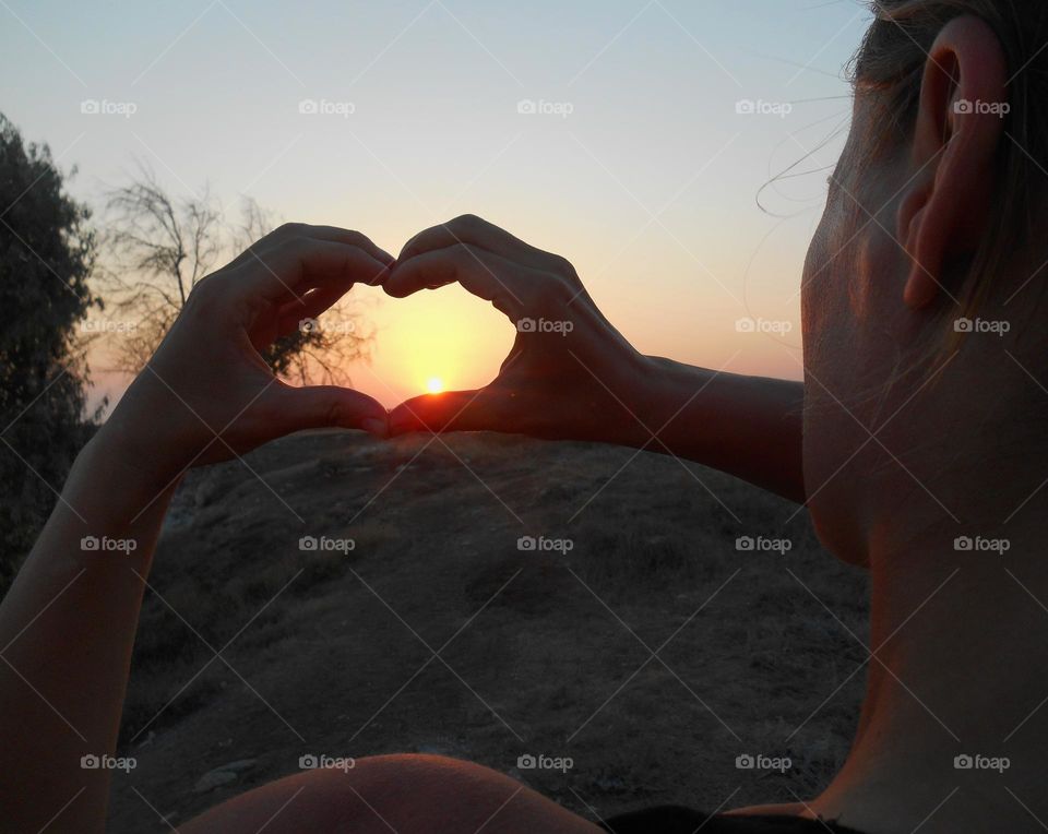 happiness outdoor sunset and hands heart