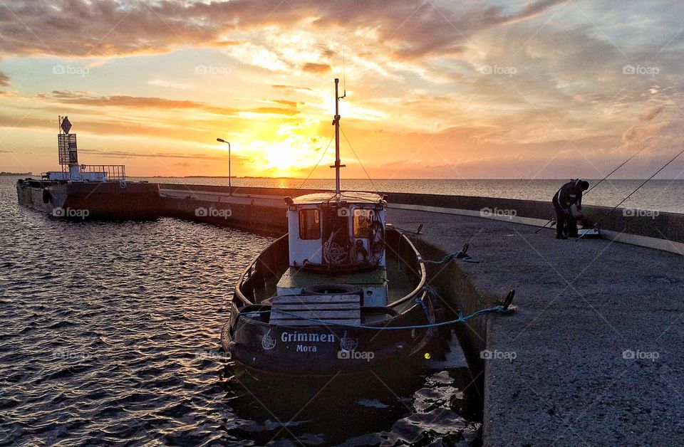 Fisherman in sunset