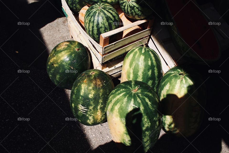 Watermelons being sold at a market in Hvar, Croatia outdoors during summer in sunlight