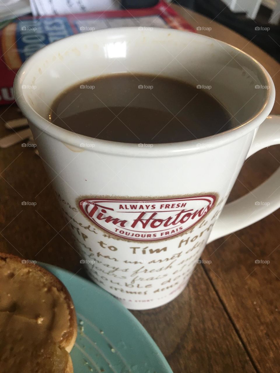 I love Tim Hortons (Canadian donuts and coffee brand) coffee with cream, with my peanut butter toast in the morning for breakfast