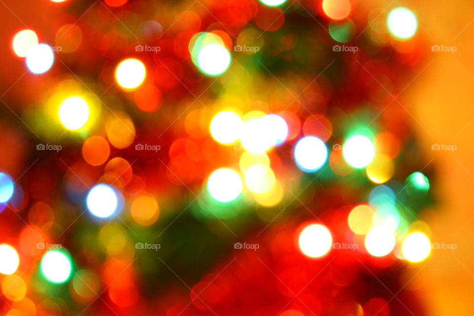 Macro shot of Christmas tree decorations and vivid lights
