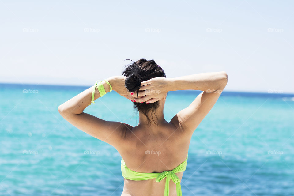 woman enjoying sun. woman enjoying sun and summertime on beach