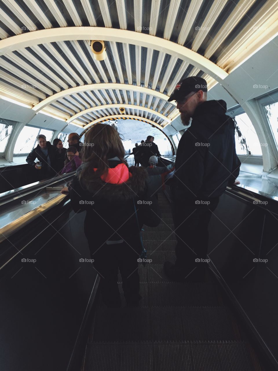 People on sn escalator